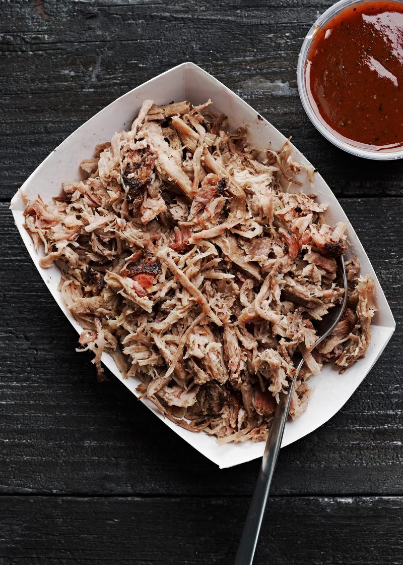 A tray of Carolina pulled pork with sauce